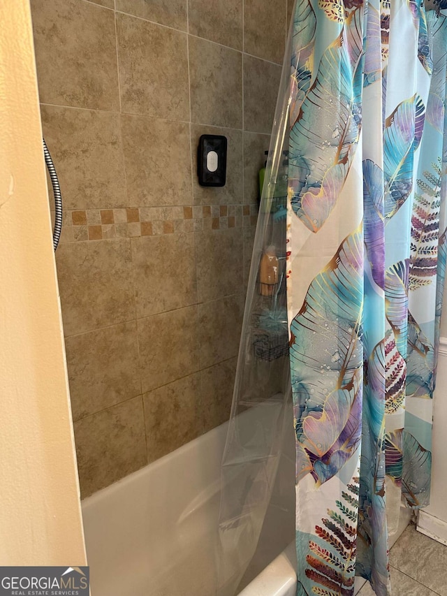 bathroom with shower / bath combination with curtain