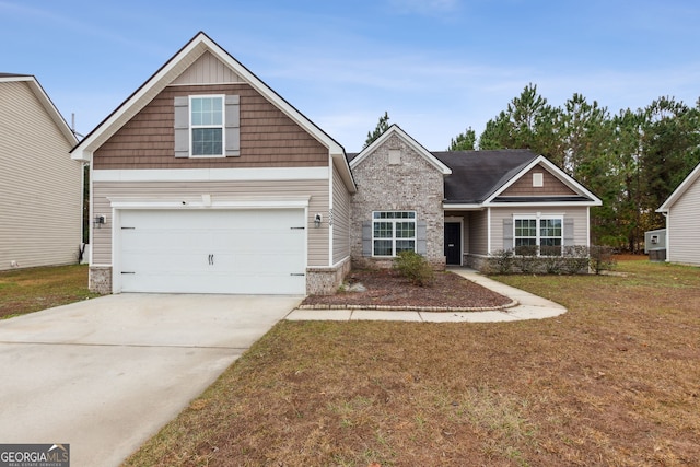 craftsman-style house featuring a front yard and a garage