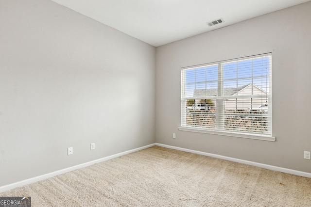 spare room featuring carpet flooring