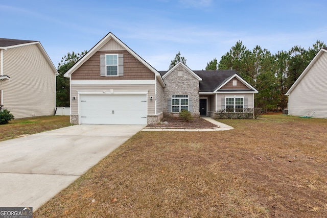 craftsman-style house featuring a front lawn and a garage