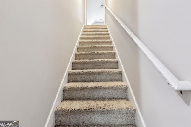 staircase with carpet