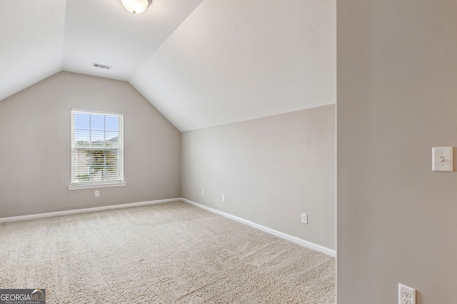 bonus room featuring carpet flooring and lofted ceiling