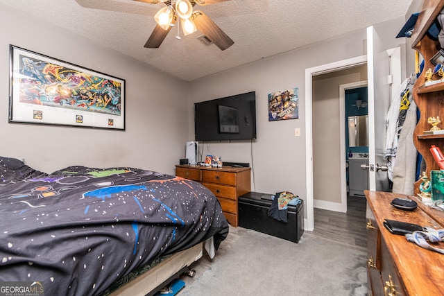 bedroom with a textured ceiling, ceiling fan, carpet, and visible vents