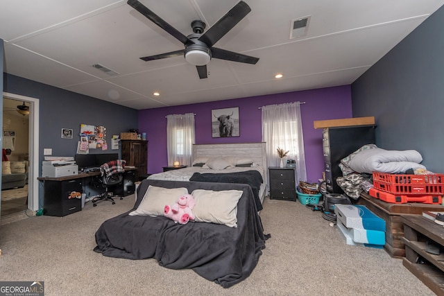 bedroom with visible vents, ceiling fan, and carpet flooring