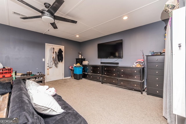 carpeted living room featuring a ceiling fan, recessed lighting, and visible vents