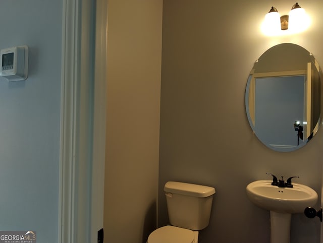 bathroom featuring toilet