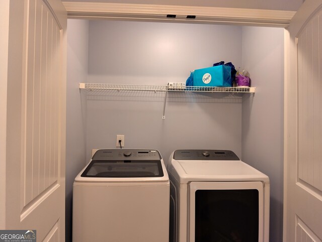 laundry room with washer and dryer