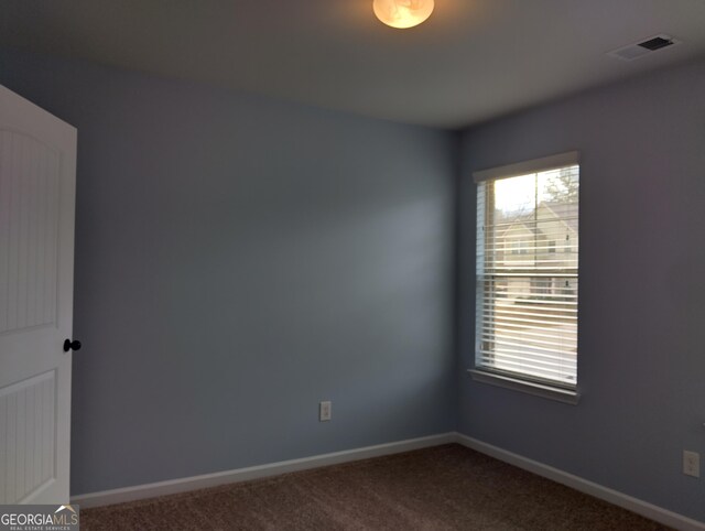 view of carpeted spare room