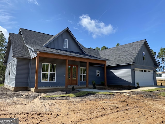 1950 Payne Rd, Rentz, GA 31075 - modern farmhouse featuring roof with shingles, a garage, driveway, and french doors