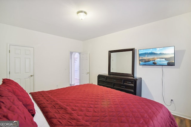 bedroom with hardwood / wood-style floors