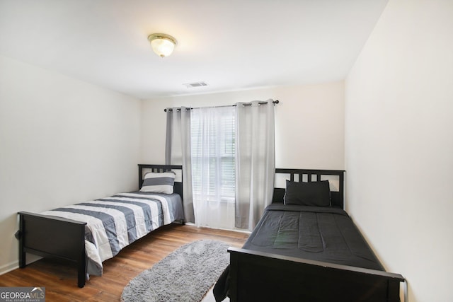 bedroom featuring wood-type flooring