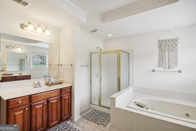 bathroom featuring tile patterned floors, vanity, a raised ceiling, crown molding, and independent shower and bath