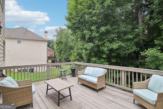 wooden deck featuring outdoor lounge area