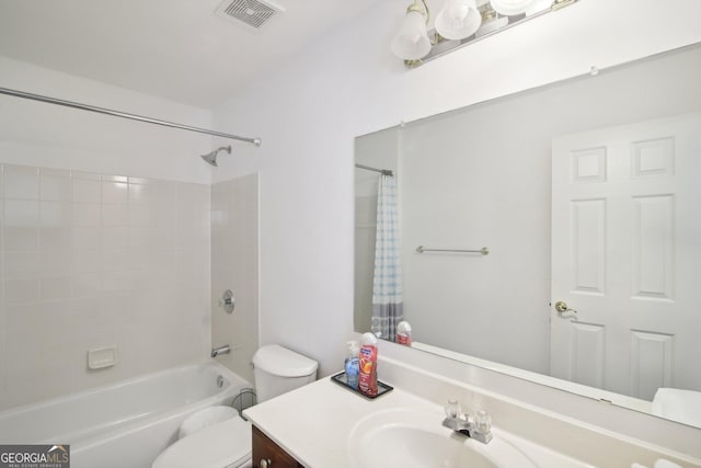 full bathroom with shower / bath combo with shower curtain, vanity, and toilet