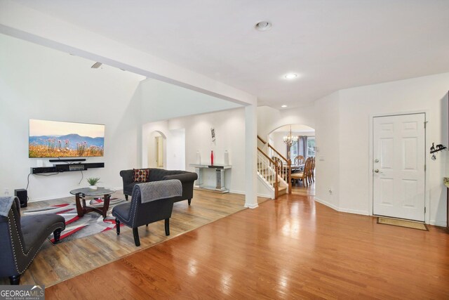 interior space featuring light wood-type flooring and a notable chandelier