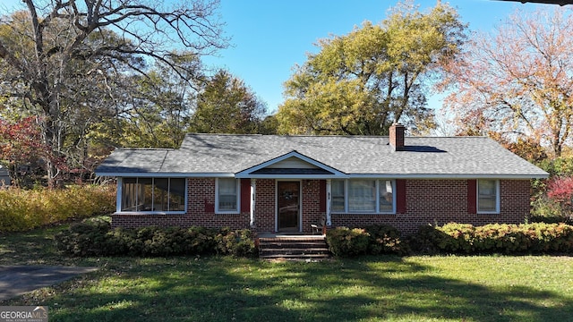 single story home featuring a front yard