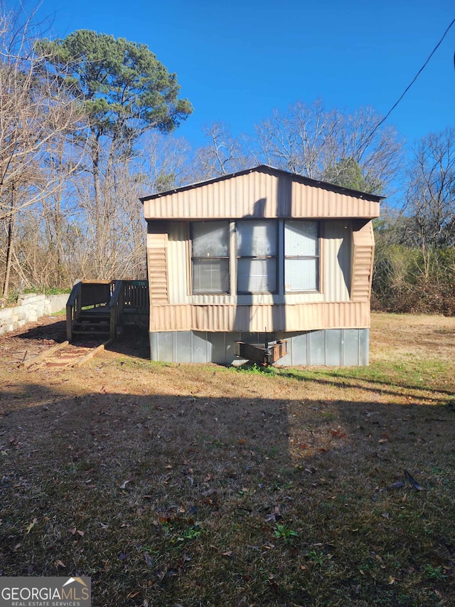 view of side of home featuring a deck