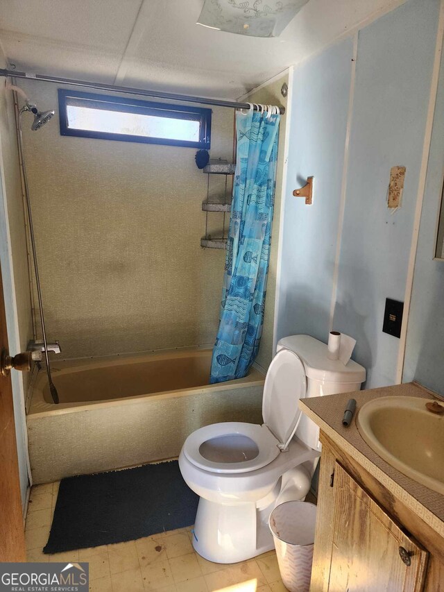 full bathroom featuring vanity, toilet, and shower / tub combo with curtain