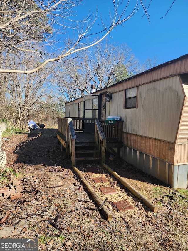 exterior space featuring a wooden deck