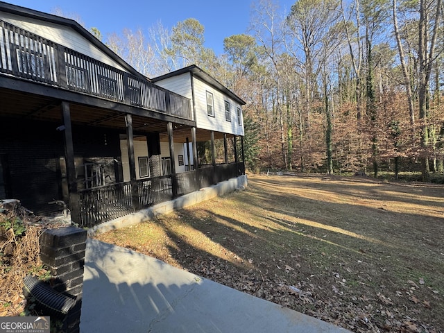 view of side of home with a wooden deck