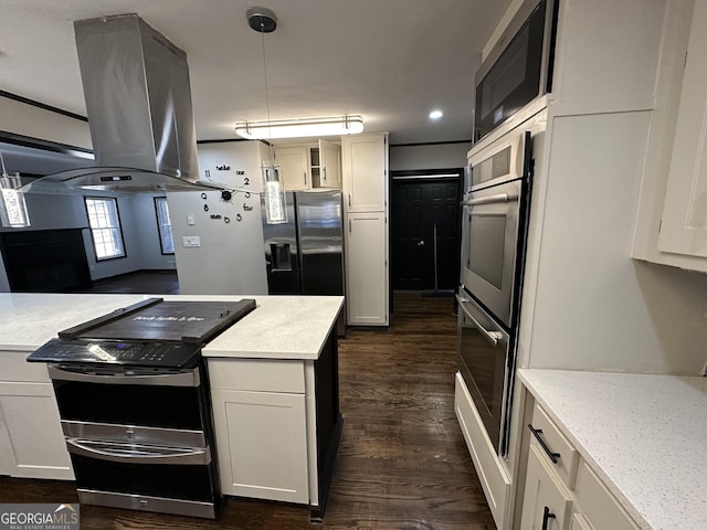 kitchen with pendant lighting, dark hardwood / wood-style floors, appliances with stainless steel finishes, island range hood, and white cabinetry