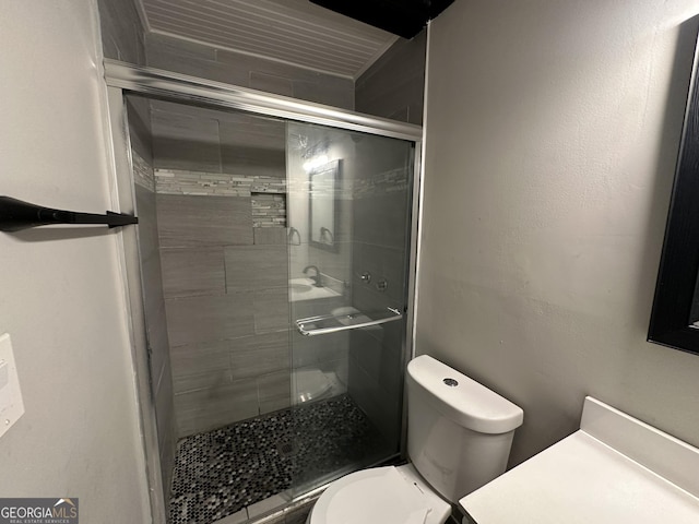 bathroom with toilet and walk in shower