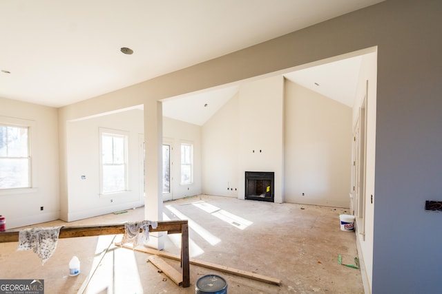 living room featuring lofted ceiling