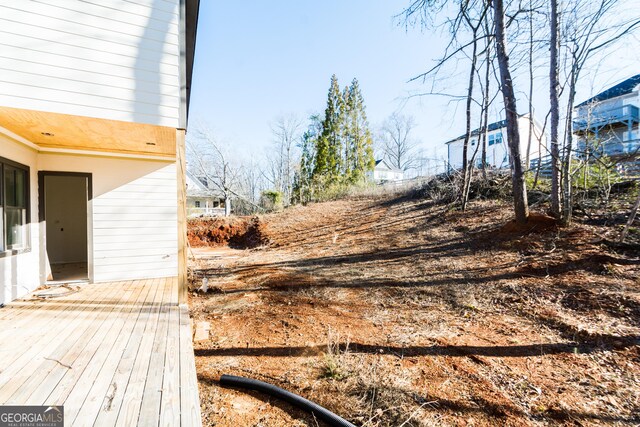 view of yard with a wooden deck