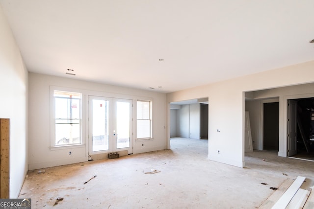 spare room featuring french doors