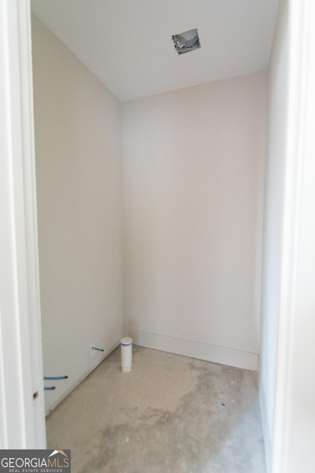 spare room with concrete flooring