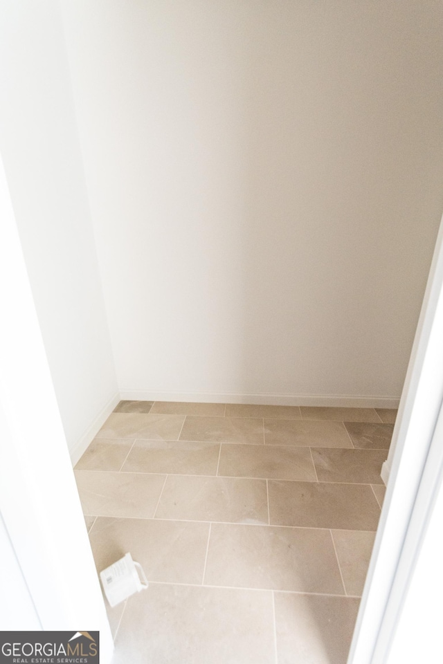 spare room featuring tile patterned flooring