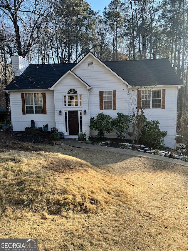 ranch-style house featuring a front yard