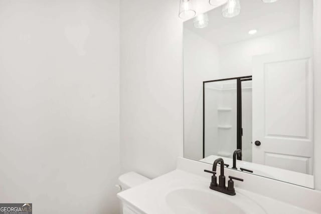 bathroom with vanity and toilet