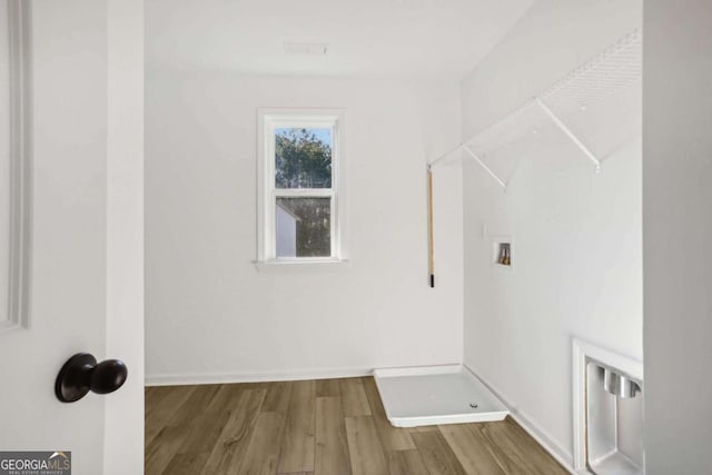 washroom featuring washer hookup and hardwood / wood-style flooring