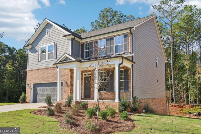 view of front of house featuring a garage and a front yard