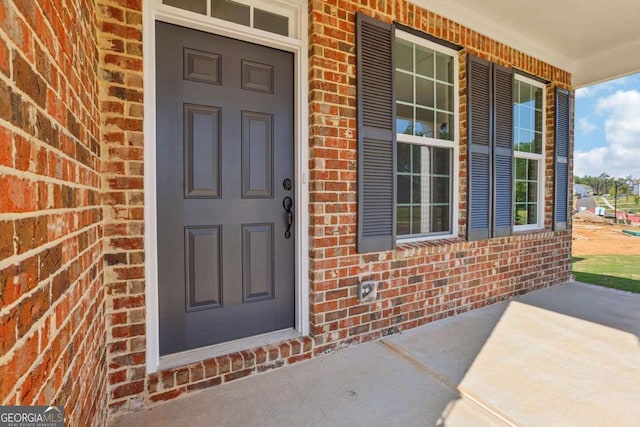 doorway to property featuring a porch