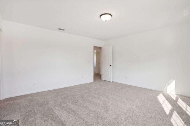 empty room featuring carpet floors