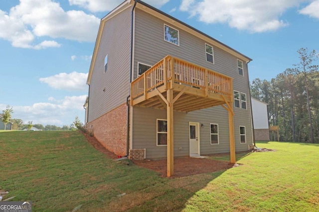 rear view of property with a lawn and a deck