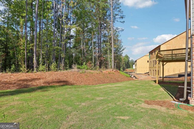 view of yard with a wooden deck