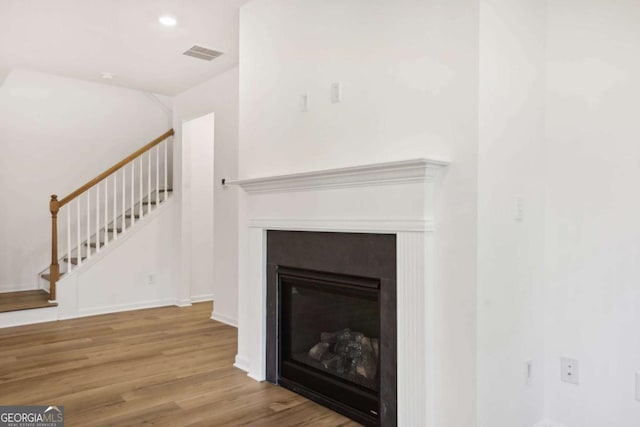 details featuring wood-type flooring