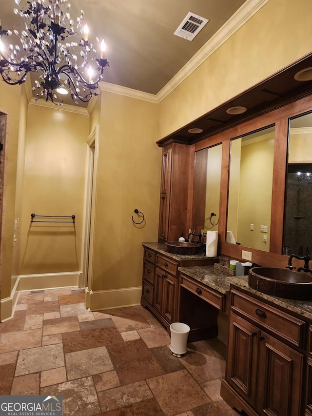 bathroom featuring vanity, crown molding, and a notable chandelier