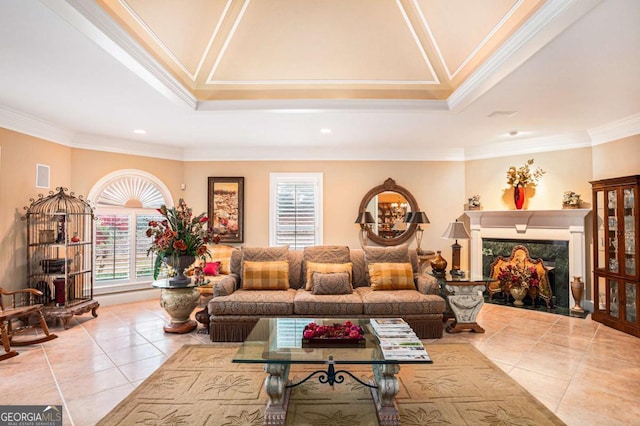 living room featuring ceiling fan, light tile patterned flooring, and ornamental molding