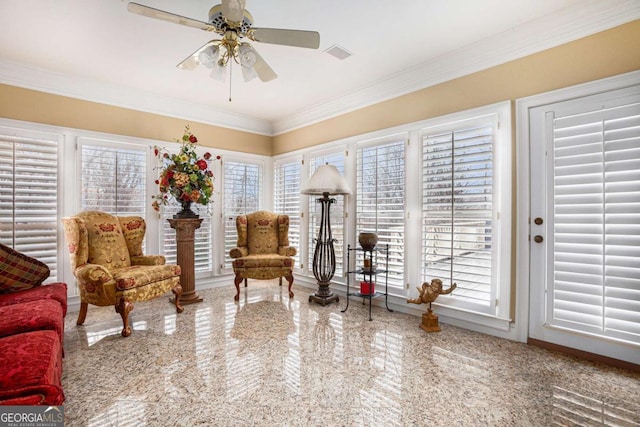 bedroom with ceiling fan, crown molding, light carpet, and a tray ceiling