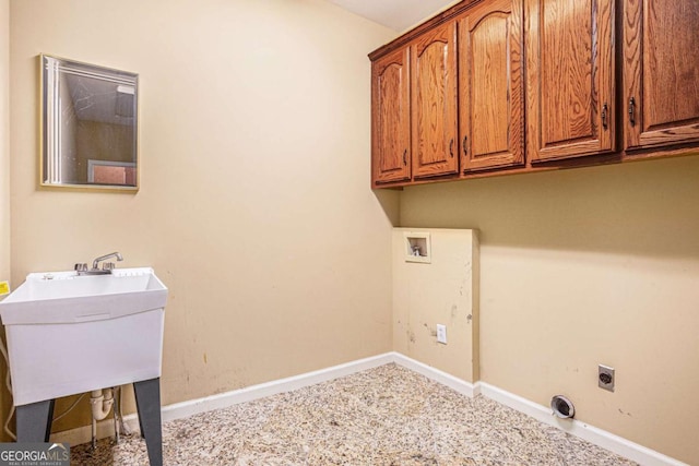 interior space with a paneled ceiling, sink, a fireplace, and ornamental molding