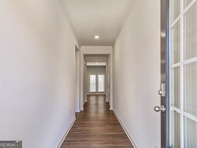 hallway featuring dark hardwood / wood-style floors and ornamental molding