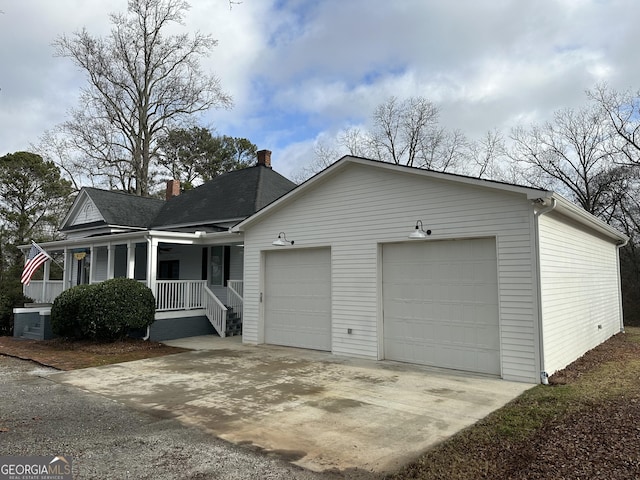 view of front of house featuring a porch and a garage