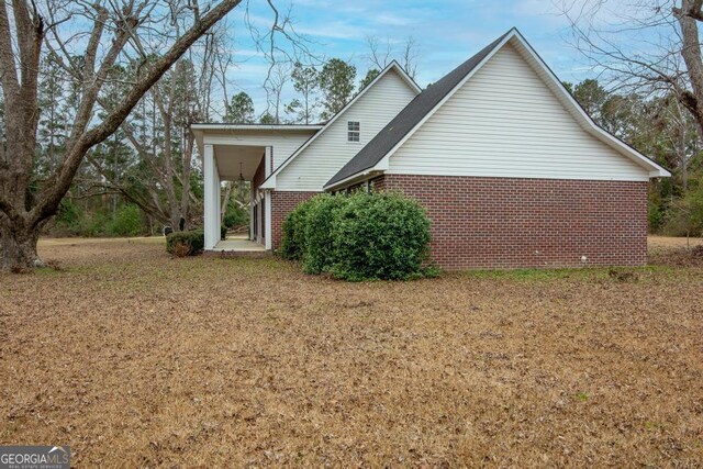 back of house with a yard and cooling unit