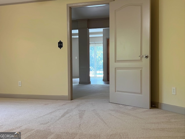 empty room featuring light colored carpet