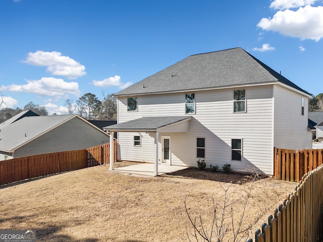 back of property with a patio