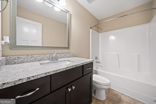 full bathroom featuring vanity, washtub / shower combination, and toilet